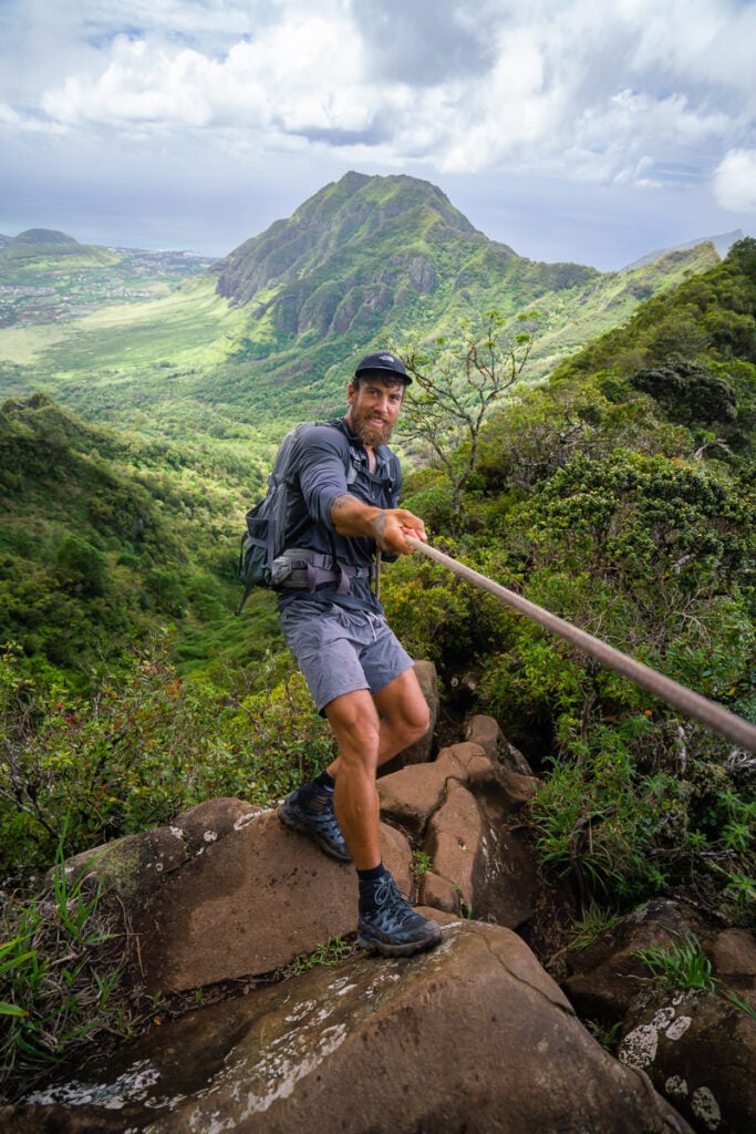 a man hiking up the side of a mountain.
